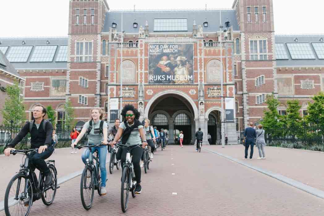 cycling through rijksmuseum in amsterdam