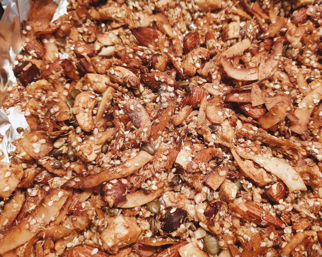 Grain Free Coconut Granola Recipe laid out on a baking tray after baking 