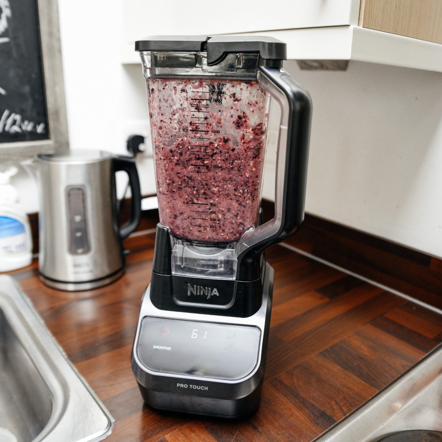 best blender for smoothies by Ninja with blueberry smoothie in jug. 